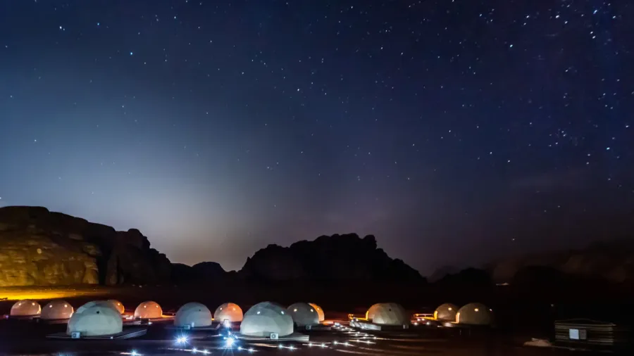 stars above martian dome tents in wadi rum desert jordan