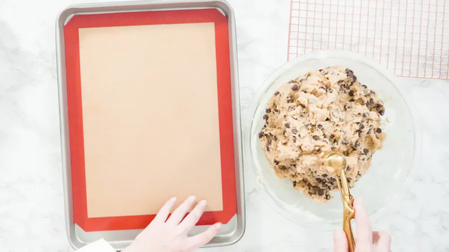 step by step flat lay scooping homemade chocolate chip cookies
