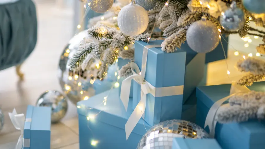 Stylish Christmas interior decorated in blue colors comfort home sofa.