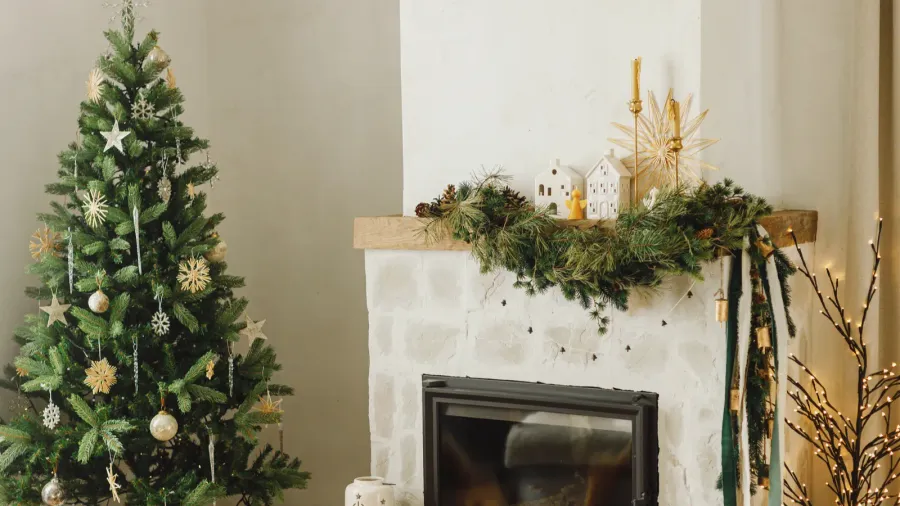 stylish decorated christmas tree with vintage ornaments and modern decor