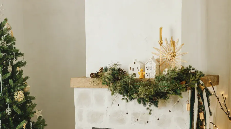 Stylish decorated Christmas tree with gold vintage ornaments and gold modern decor.