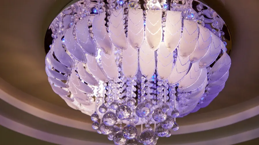 stylish designer chandelier on the ceiling in the hall