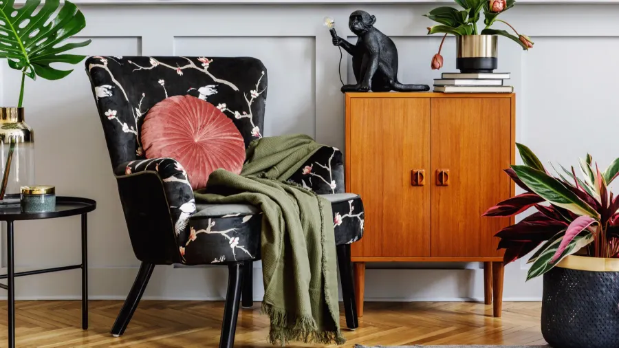 stylish interior of living room with design armchair wooden vintage