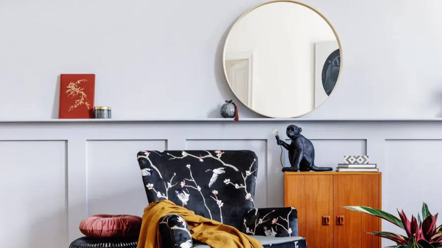 stylish interior of living room with design armchair wooden vintage