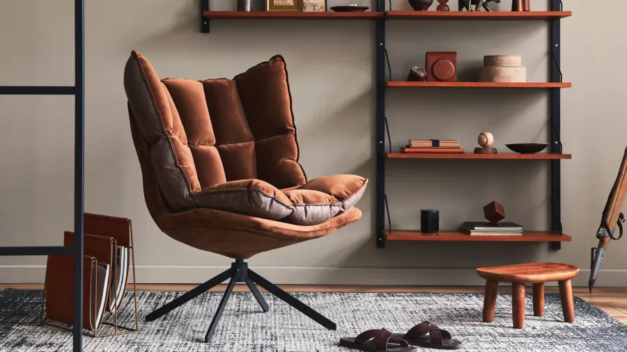 stylish interior of living room with design brown armchair wooden