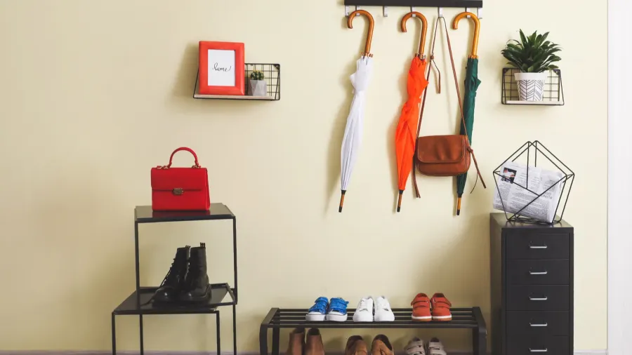stylish interior of modern hall with umbrellas and shoes