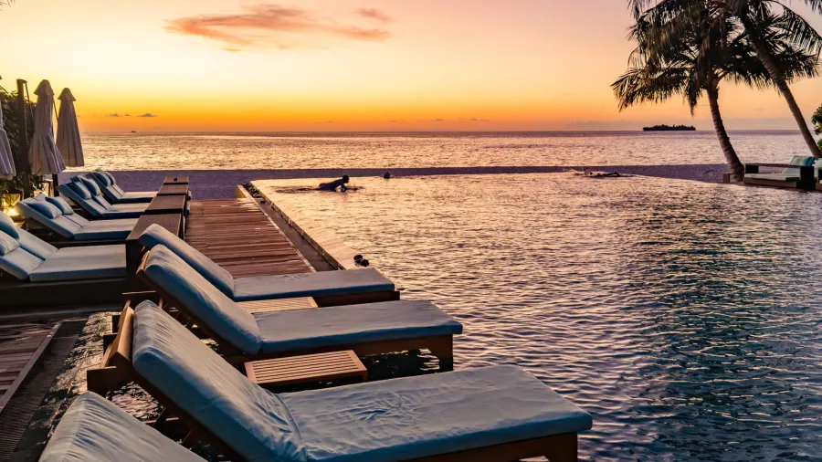 sunset views from overwater pool villa in maldives high quality