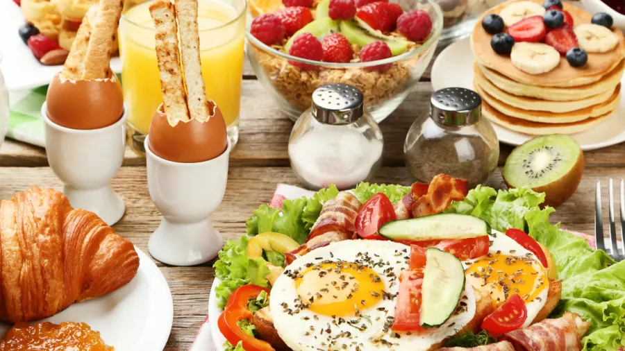tasty breakfast on wooden table