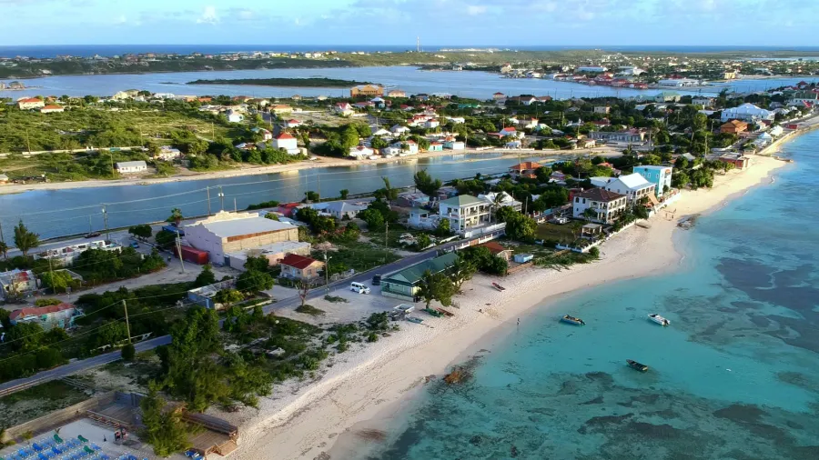 the aerial view of the resorts along the shore with