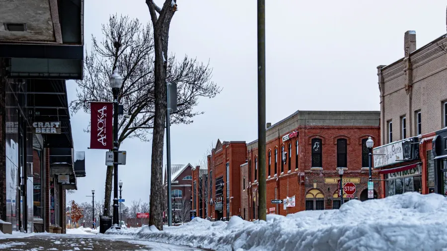 the buildings and the sidewalk of anoka city covered in