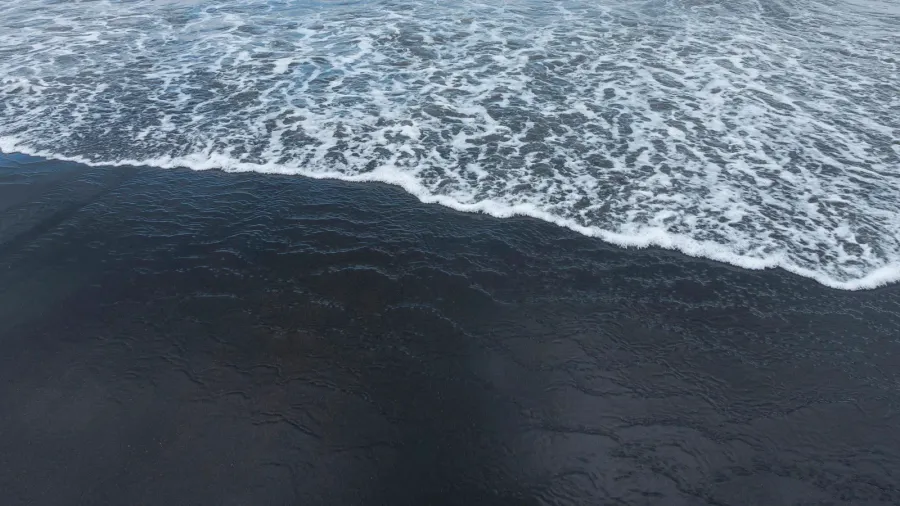 the famous black sand of bali seseh beach indonesia located
