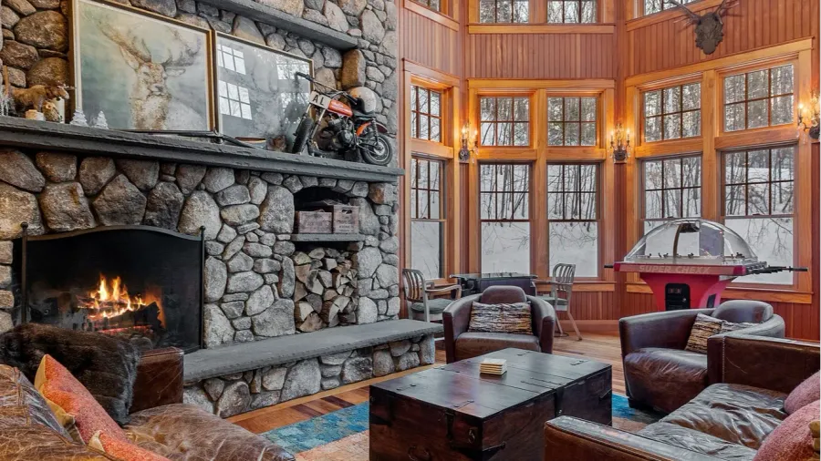 the living room of a contemporary rustic home in the