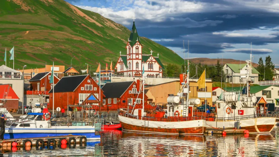 town of husavik at sunset north coast of iceland