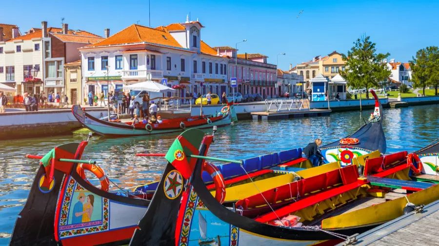 traditional boats on the canal in aveiro portugal colorful mol