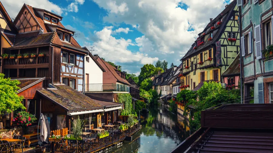 tranquil canals with reflections in the pretty town of colmar