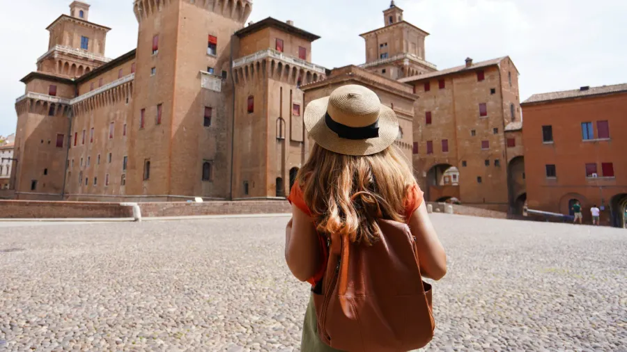 travel in italy rear view of traveler girl walking towards