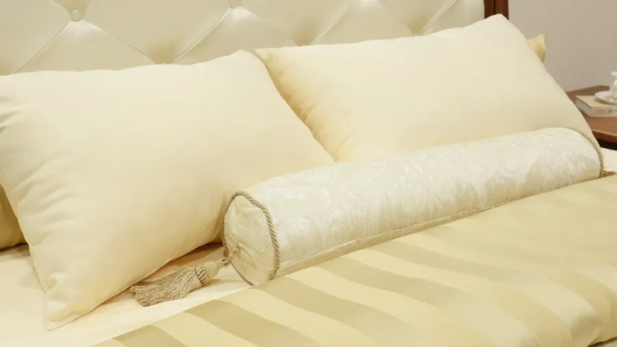 two pillows and bolster