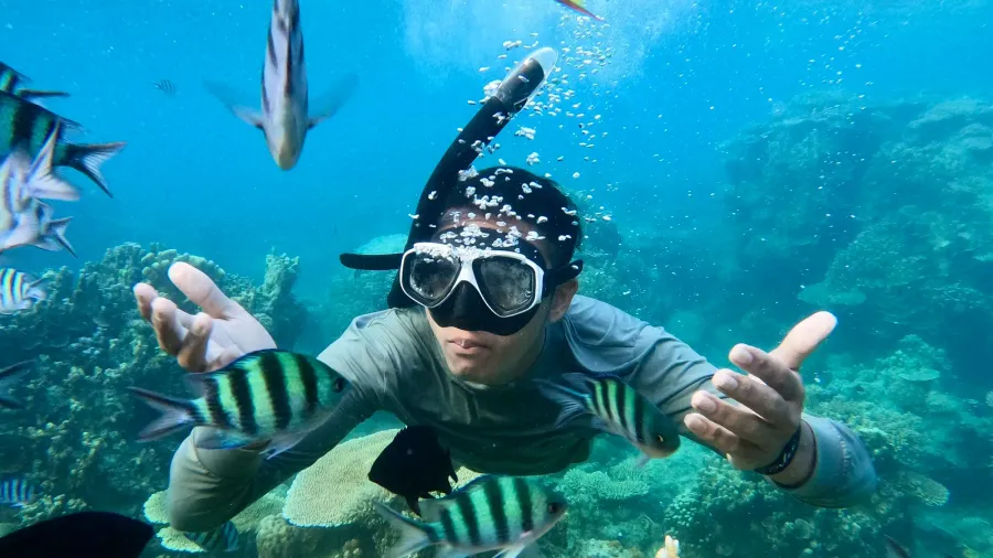 underwater shoot of a young man snorkeling in a tropical