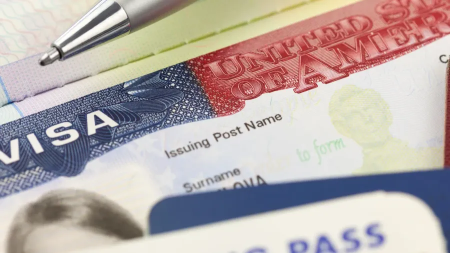usa visa passports boarding pass and pen  foreign travel