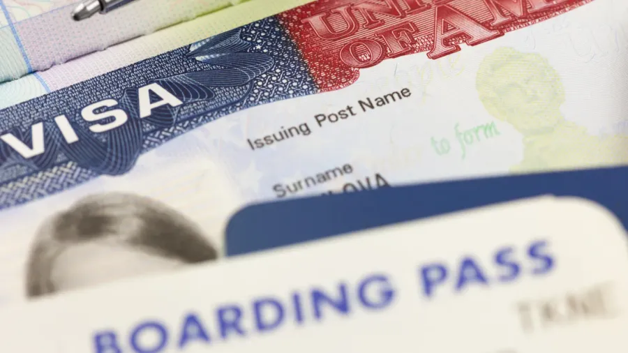 usa visa passports boarding pass and pen  foreign travel