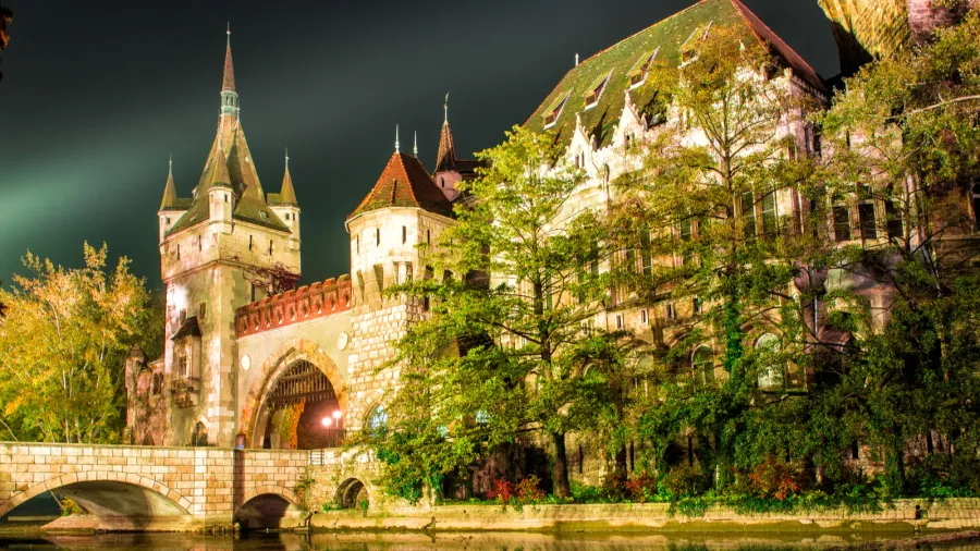 vajdahunyad castle at the night with lake in budapest hungary