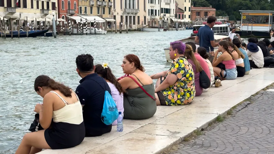 venice italy  june 23 2025 diverse individuals are seated