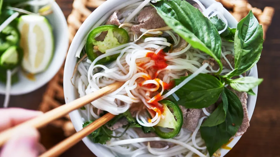 vietnamese pho with spicy sriracha sauce