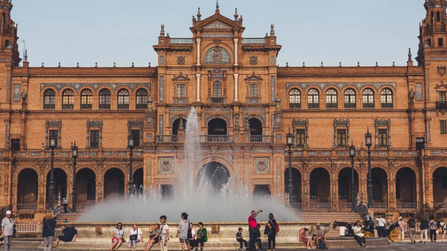 view of spain square with town hall and fountain under