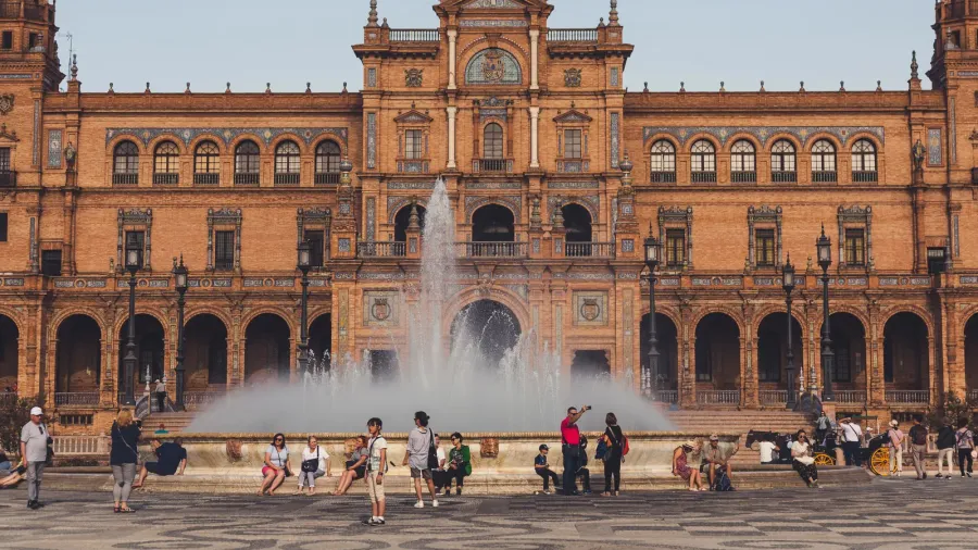 view of spain square with town hall and fountain under