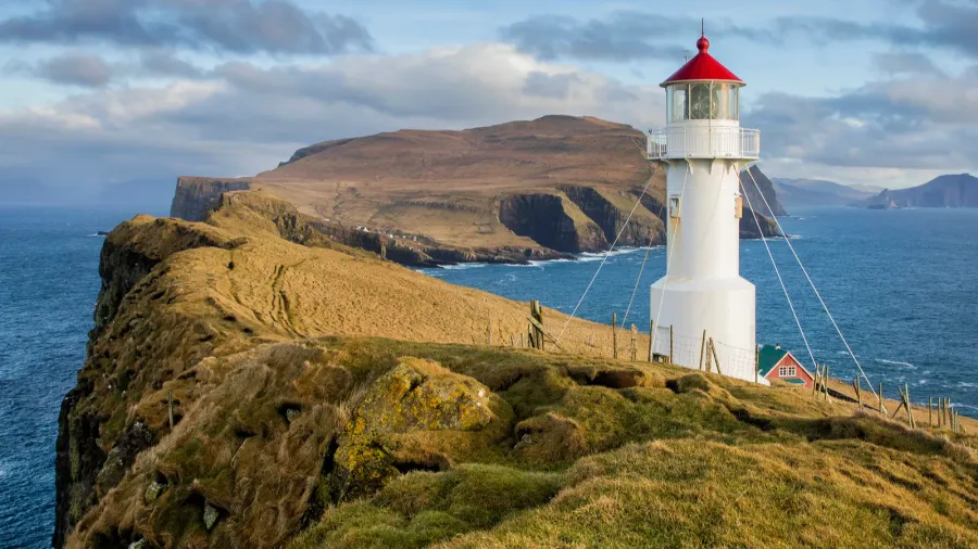 view of the holmur lighthouse on the island of mykines