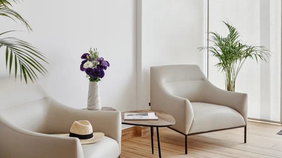 waiting area with two chairs by the window