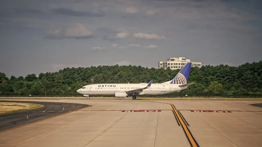 United Airlines plane departure in airport.