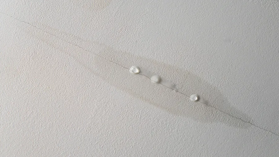 water is leaking from drywall ceiling in home room water