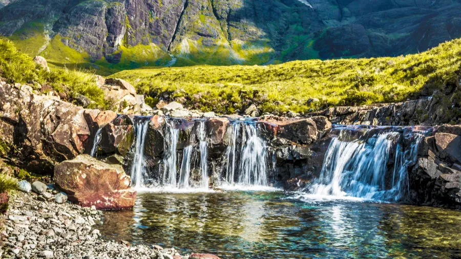 waterfall with mountains on a background