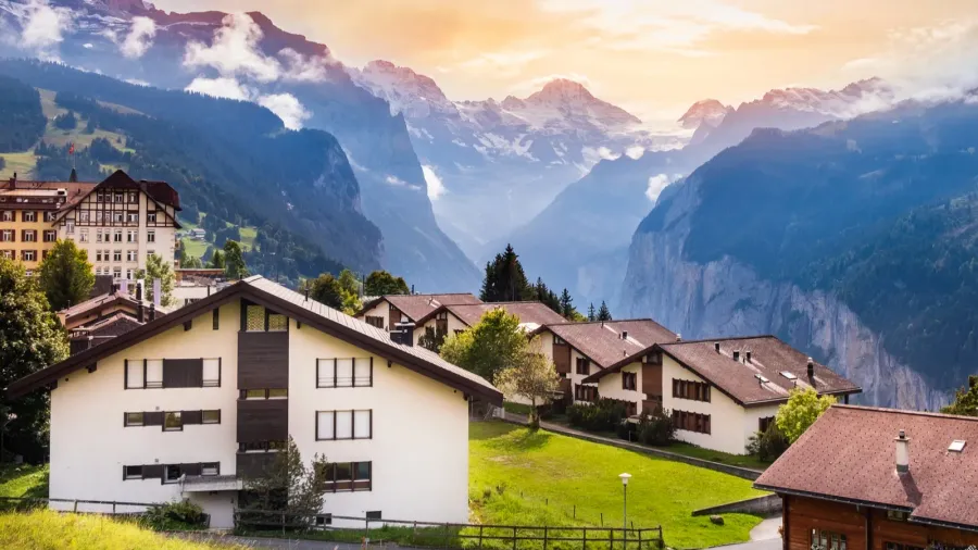 wengen town in switzerland at sunset view over swiss alps