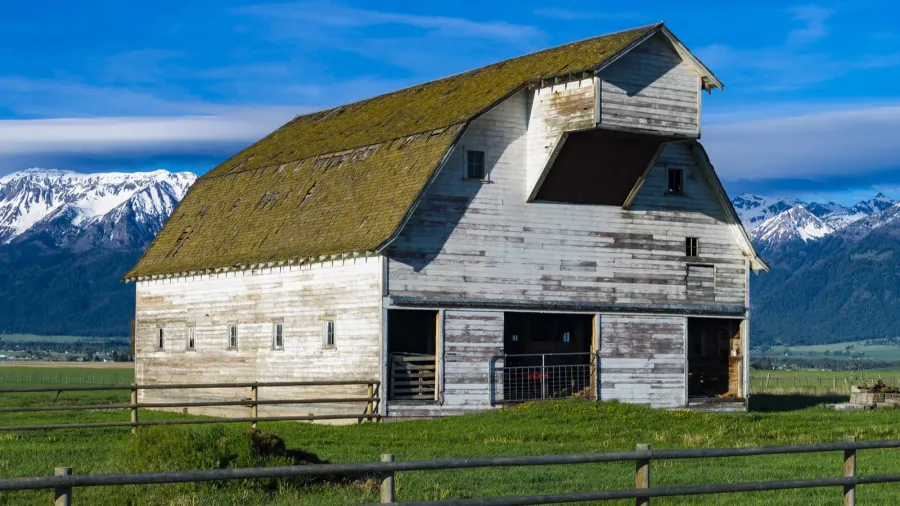 white barn near mountains in eastern oregon