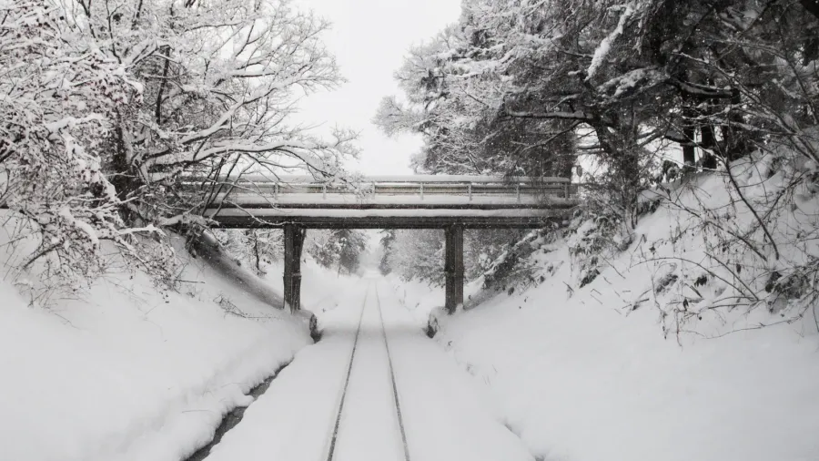 white snow covered tracks on tsugaru railway line in aomori