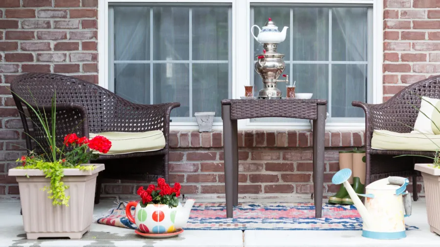 wicker furniture on the patio with a samovar