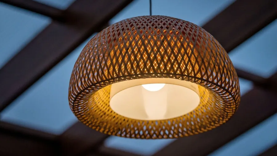 A woven pendant lighting fixture hanging from the ceiling.