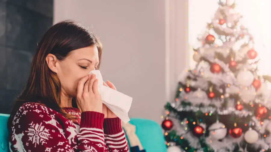 woman blowing nose