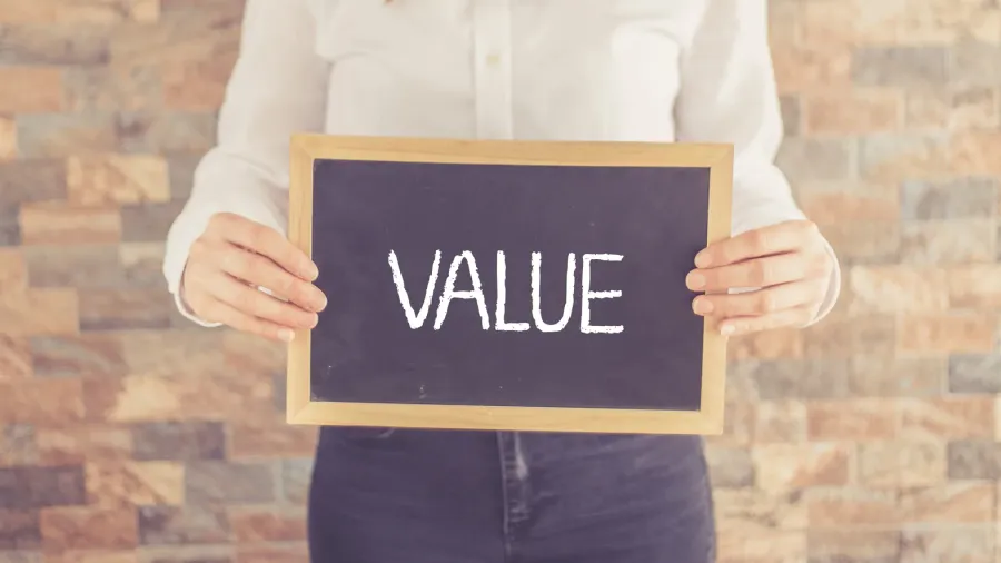 woman holding board with text