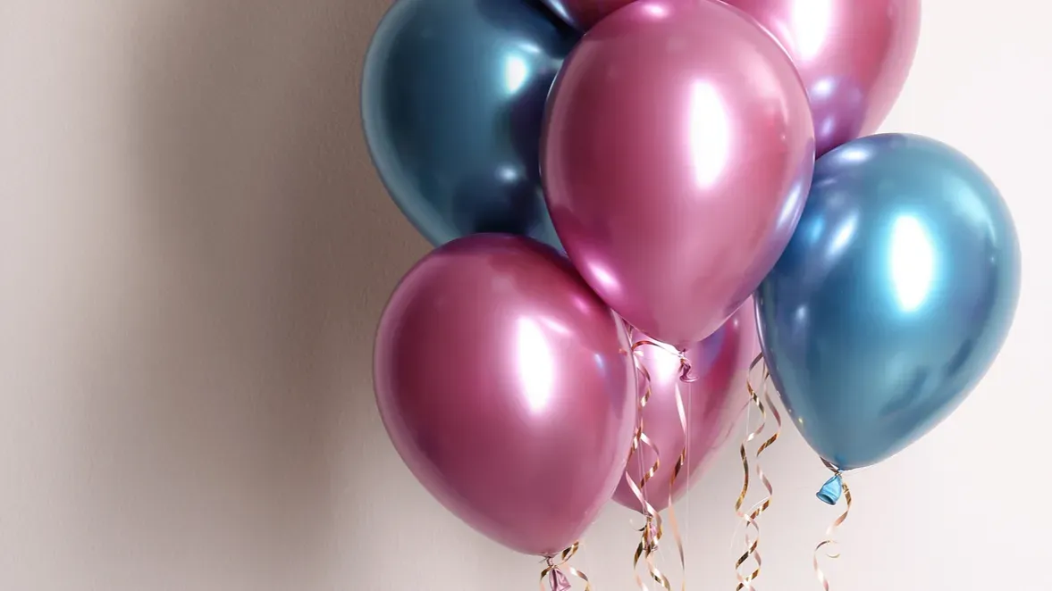 woman holding bunch of balloons on white background closeup