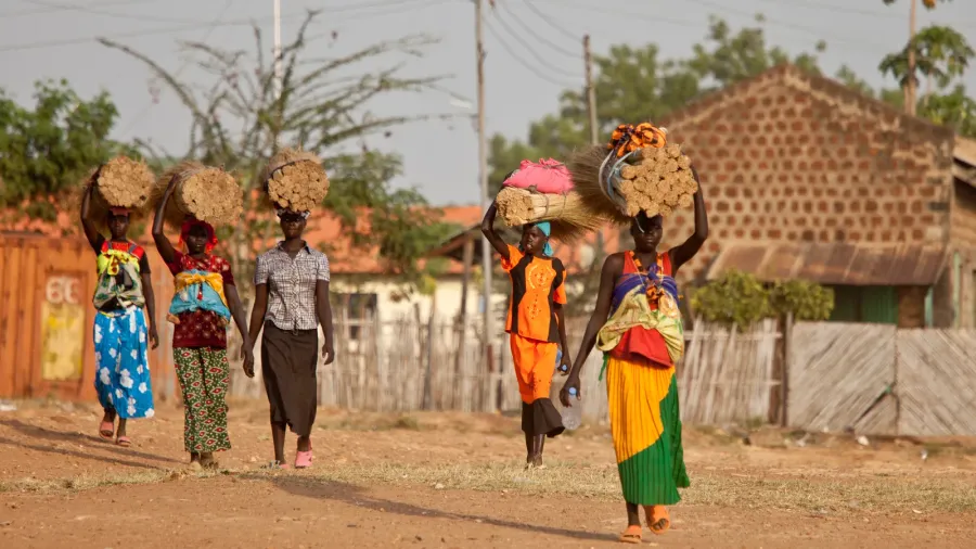 women carrying loads south sudan