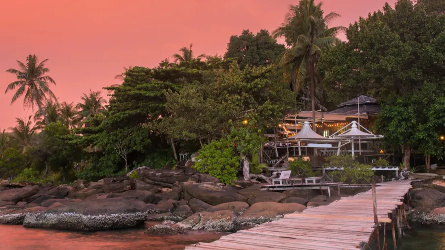 wooden pier to a tropical island resort on koh kood