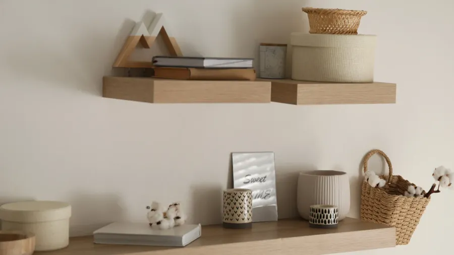 wooden shelves with books and different decorative elements on light