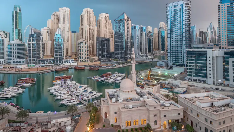 yachts in dubai marina flanked by the al rahim mosque