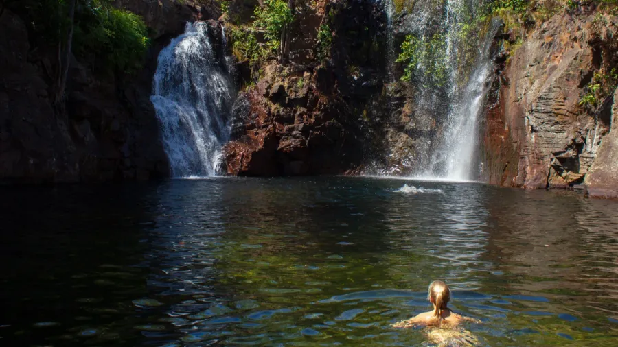 youn girl enjoy srefreshing swim at florence falls very popular