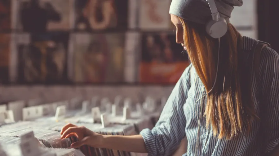 young attractive girl in a vinyl record store