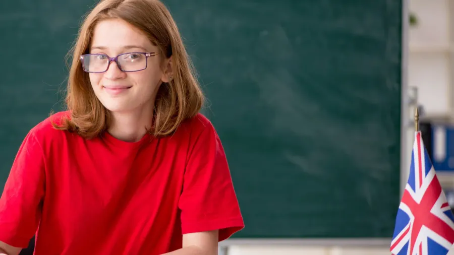 young female student preparing for exams in the classroom