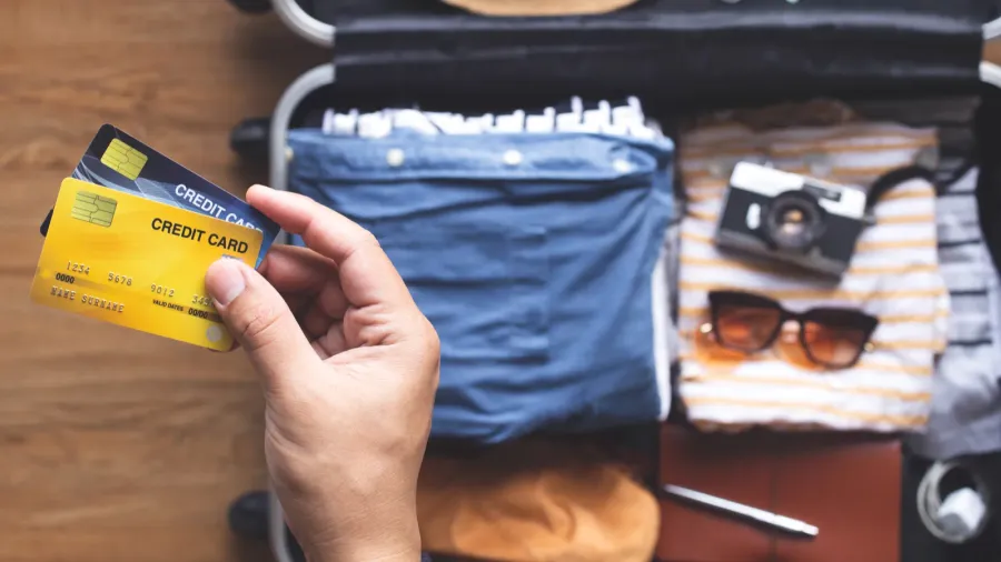 Young person using credit cards for payment on vacation or holiday trip.convenient lifestyle with technology.banking and financial.